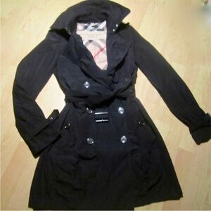 Black Burberry trench coat.